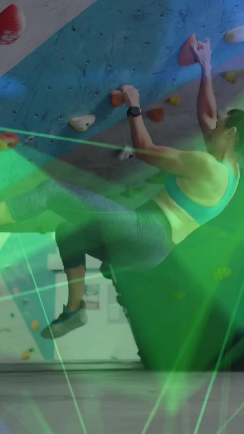 Animation of data processing over caucasian woman climbing wall Stock Footage 323900160