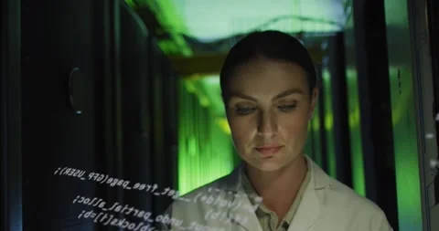 Animation of data processing over caucasian woman checking servers Stock Footage 328290032