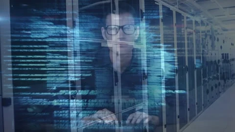 Animation of data processing over caucasian male hacker using a laptop against Stock Footage 328934179