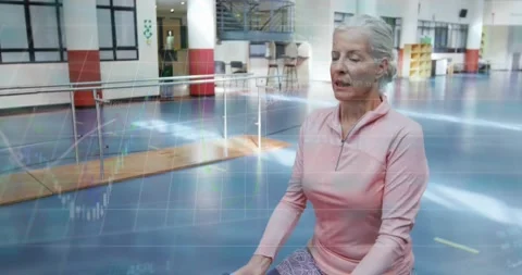 Animation of data processing over caucasian woman exercising Stock Footage 329123795