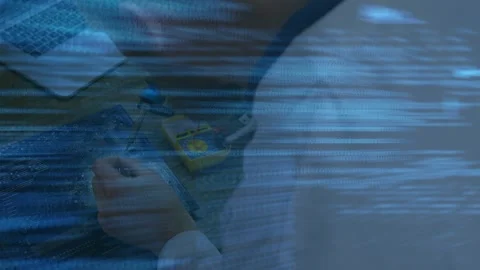 Animation of data processing over caucasian male engineer working with Stock Footage 329853763