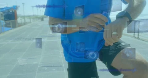 Animation of data processing over caucasian sportsman checking smartwatch Stock Footage 330336602