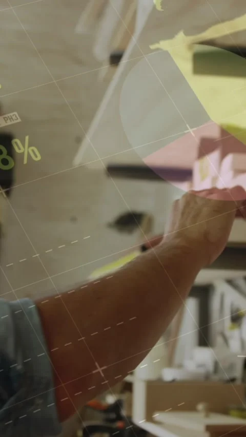 Animation of data processing over caucasian male carpenter working in workshop Stock Footage 343738409