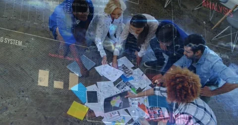 Animation of data processing over diverse colleagues discussing over documents Stock Footage 203883925
