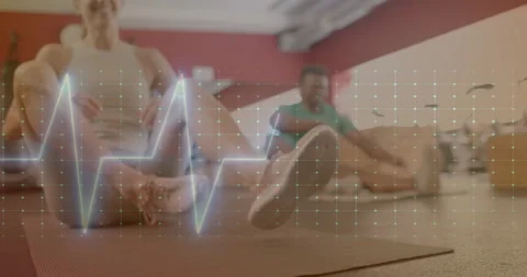 Animation of data processing over diverse man and woman exercising in gym Stock Footage 310303341