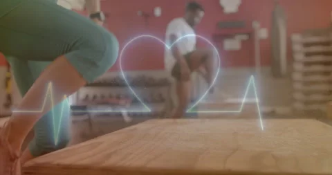 Animation of data processing over diverse man and woman exercising in gym Stock Footage 310303355