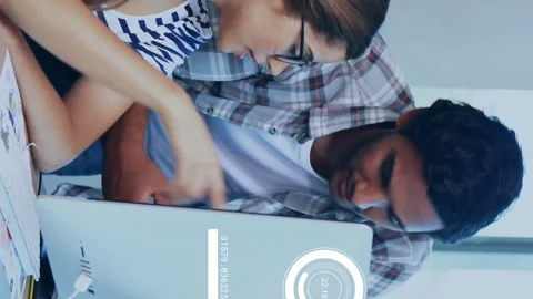 Animation of data processing over diverse colleagues discussing work in office Stock Footage 315432758