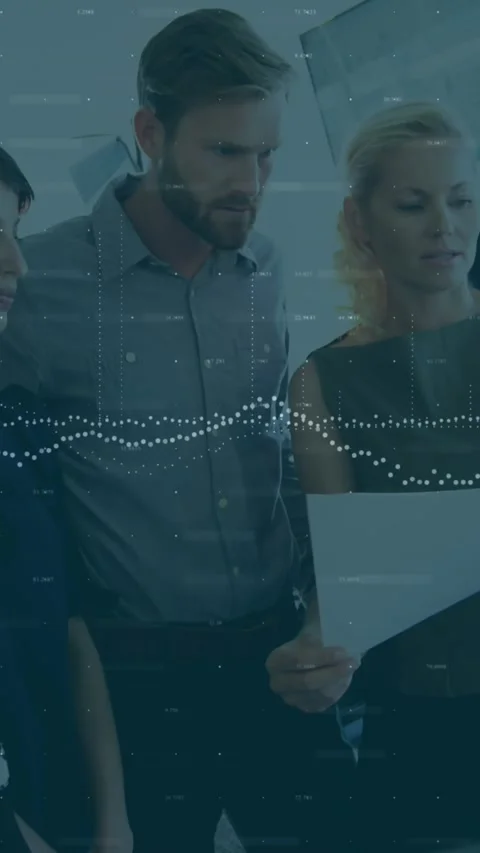 Animation of data processing over diverse team of colleagues reading documents Stock Footage 321853056