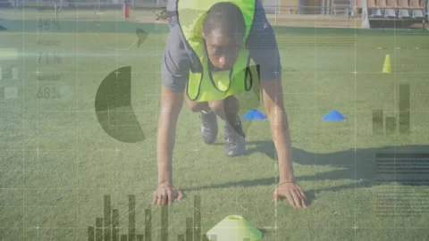 Animation of data processing over diverse soccer players exercising at stadium Stock Footage 326631695