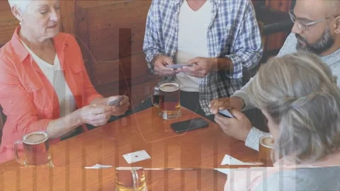 Animation of data processing over diverse senior friends in bar Stock Footage 328974378