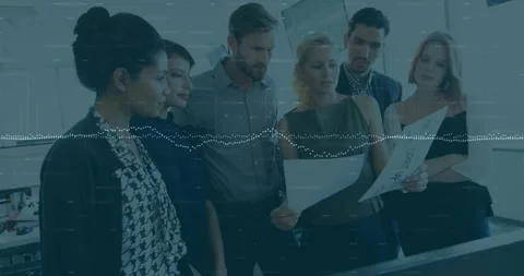 Animation of data processing over diverse team of colleagues reading documents Stock Footage 330478842