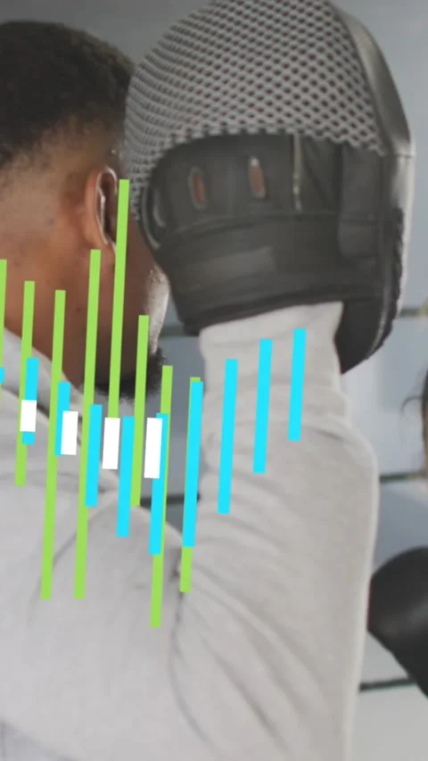 Animation of data processing over diverse man and woman exercising in boxing gym Stock Footage 342910397