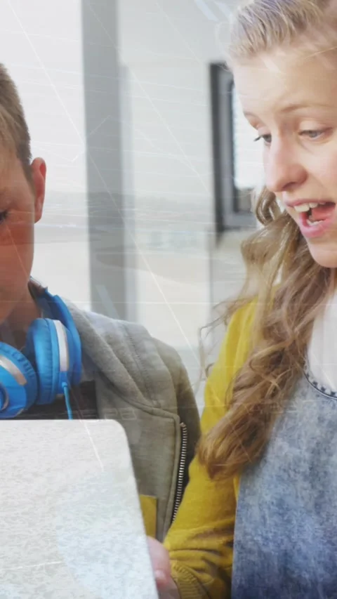 Animation of data processing over group of diverse students using laptop at Stock Footage 344594865