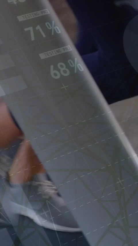 Animation of data processing over low section of women running on treadmill Stock Footage 344678360