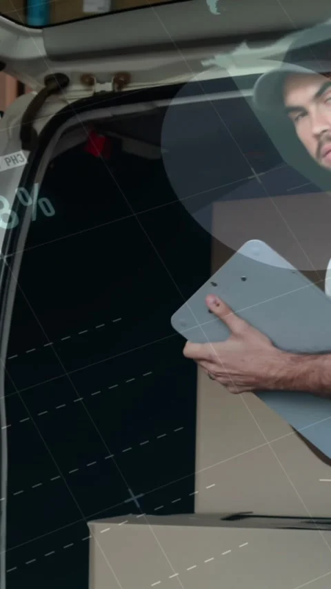Animation of data processing over man packing boxes into car Stock Footage 344706159