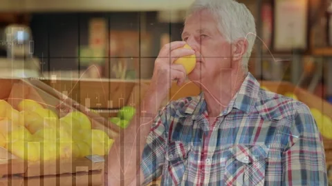 Animation of data processing over smiling senior caucasian man smelling fruit in Stock Footage 327122003