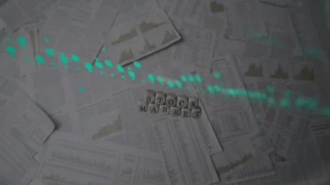 Animation of data processing over stock market text banner over documents on the Stock Footage 202117086