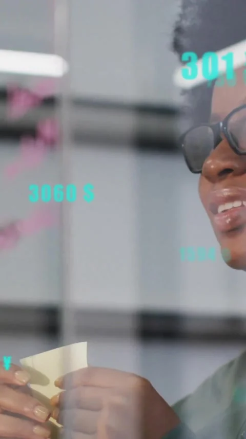 Animation of data processing over woman taking notes in office Stock Footage 320512906