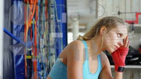 Animation of data processing over woman exercising in gym Stock Footage 327645922