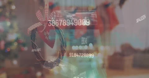 Animation of data processing on screens over christmas decoration Stockbeeldmateriaal 326759472