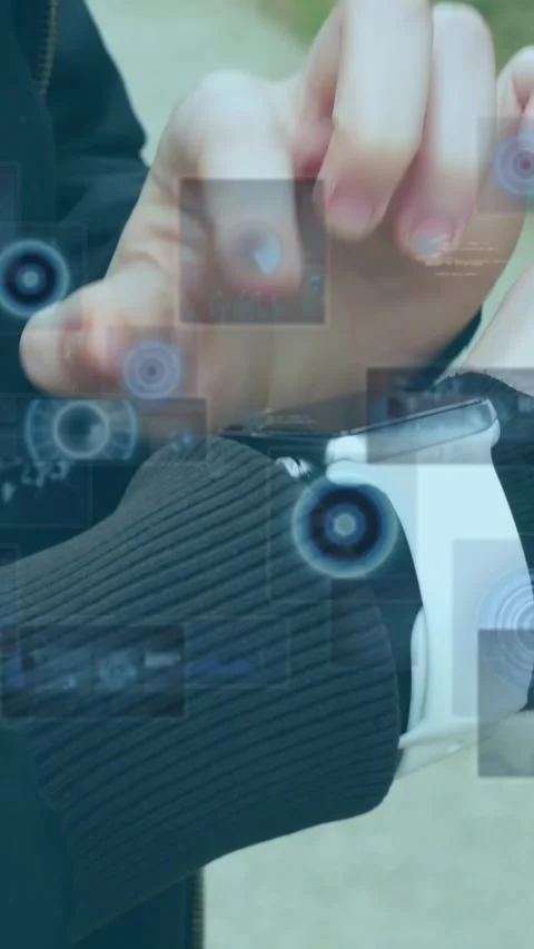 Animation of data processing on screens over caucasian man checking smartwatch Stock Footage 342953545