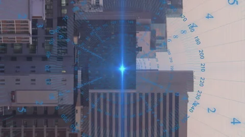Animation of data processing spinning around blue light spot against aerial view 動画素材 312645735