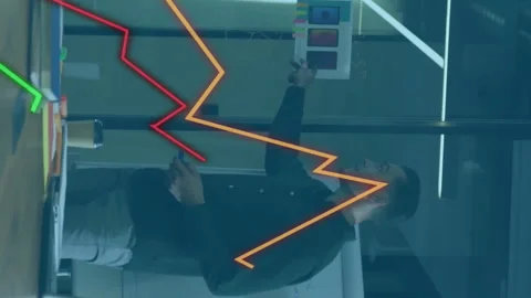 Animation of diagrams over diverse colleagues discussing work in office Stock Footage 315219652