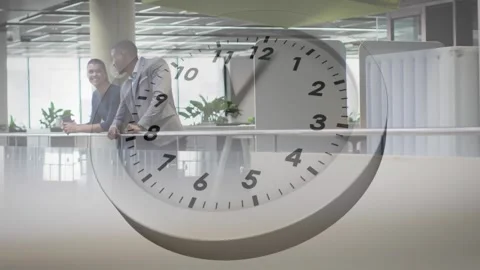 Animation of digital clock over diverse coworkers sharing ideas in office Stock Footage 243326412