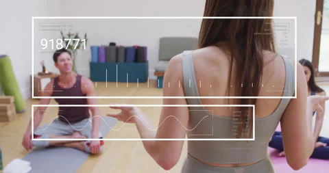Animation of digital data processing over diverse people in yoga class with Stock Footage 310408470