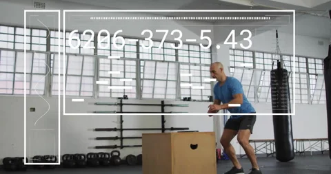 Animation of digital data processing over man exercising in gym, jumping on box Stock Footage 310408472