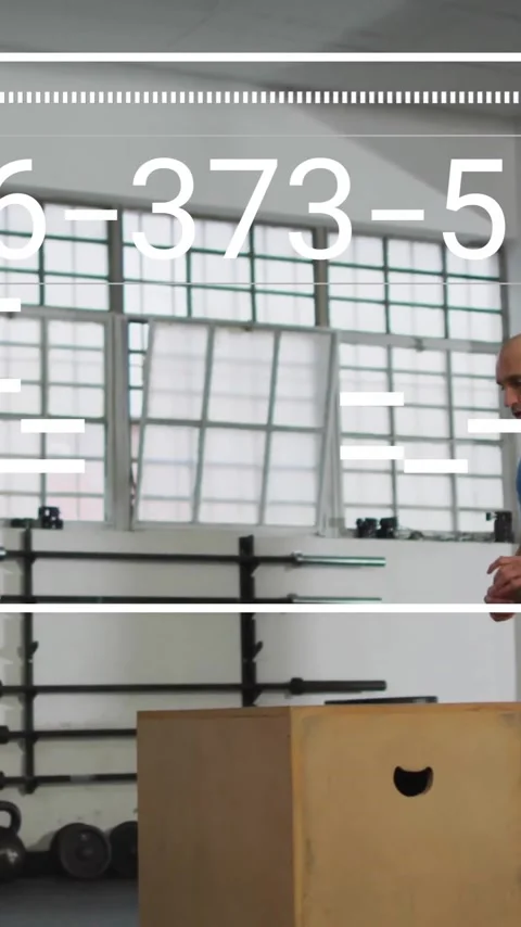 Animation of digital data processing over man exercising in gym, jumping on box Stock Footage 320378930