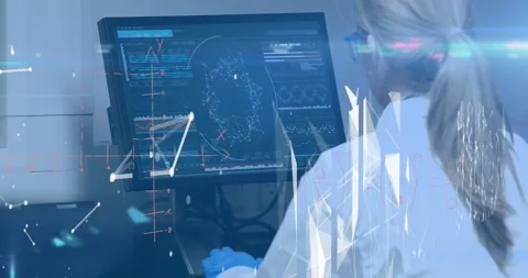 Animation of digital interface over woman using computer Stock Footage 327361903