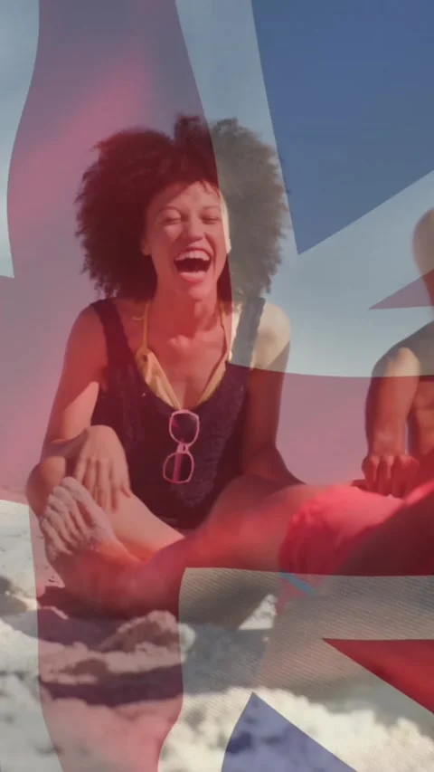 Animation of diverse friends at beach over flag of great britain Stock Footage 344636241
