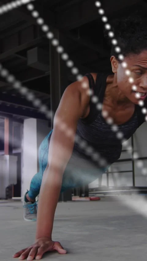 Animation of dna strain spinning over woman exercising in an abandoned building Stock Footage 323682486