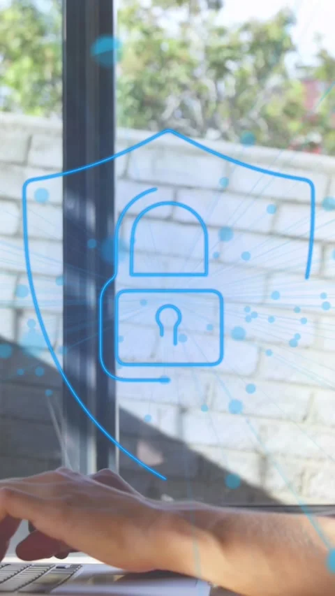 Animation of dots around padlock in shied over caucasian woman working on laptop Stock Footage 344557473
