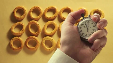 An animation of dry ring-shaped crackers Stock Footage 235155092