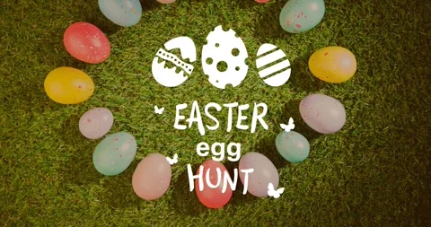 Animation of easter egg hunt text with multi coloured easter eggs in grass Stock Footage 329286559
