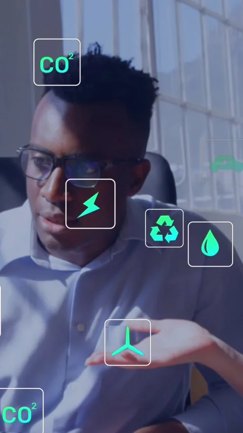 Animation of eco icons and data processing over diverse people using computer Stock Footage 344745846