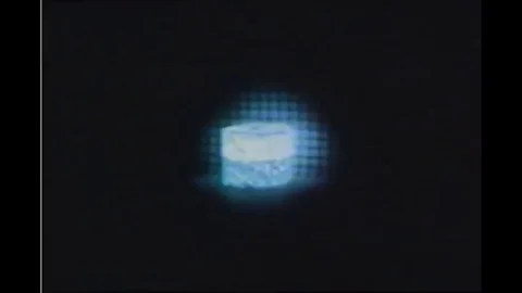 An animation explains how radioisotopes function in an atom in the 1950s Video stock 120401302