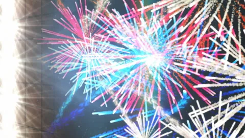 Animation of exploding colourful fireworks and spotlights on black background Stock Footage 313187341