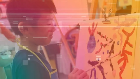 Animation of falling confetti over asian boy at art class Stock Footage 328353897