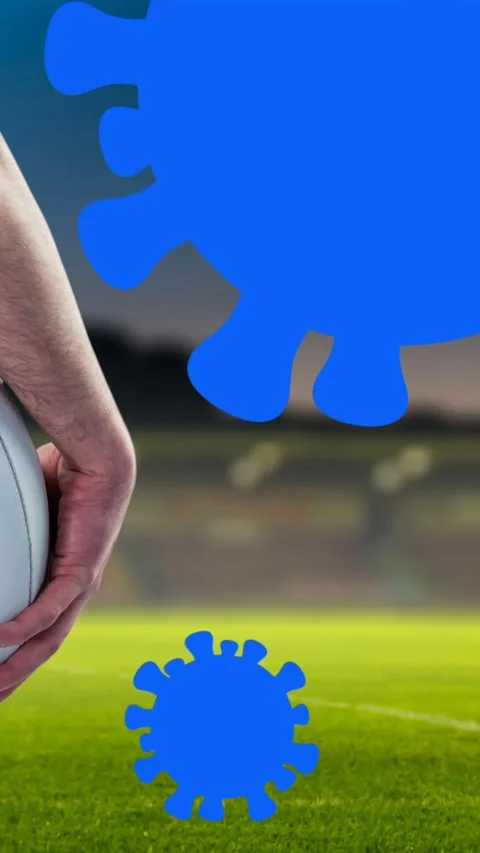 Animation of falling covid 19 cells over american football player Stock Footage 320160385