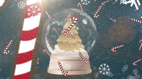 Animation of falling snow and candy canes over snowing ball Stock Footage 330250919