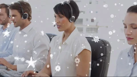 Animation of falling snow over diverse group of people using head phone sets Stock Footage 201546329