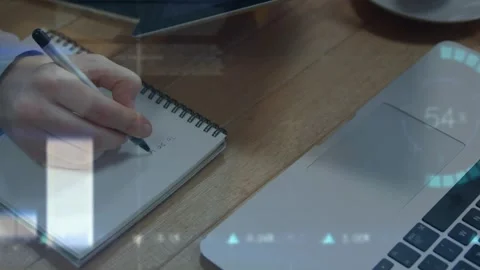 Animation of financial data and graphs over hands of caucasian man making notes Video stock 327641374