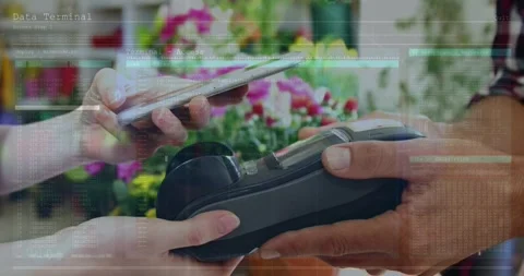 Animation of financial data over hands of diverse people using payment terminal Stock Footage 330287692