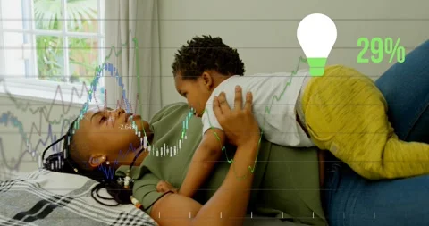 Animation of financial data processing with light bulb icon over african Vídeos de archivo 325836946