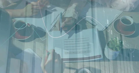 Animation of financial data processing over office colleagues checking documents Stock Footage 151980714