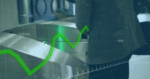 Animation of financial data processing over caucasian man using smartphone on Stock Footage 263903398
