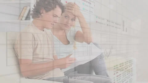 Animation of financial data processing over caucasian couple checking documents Stock Footage 266184839